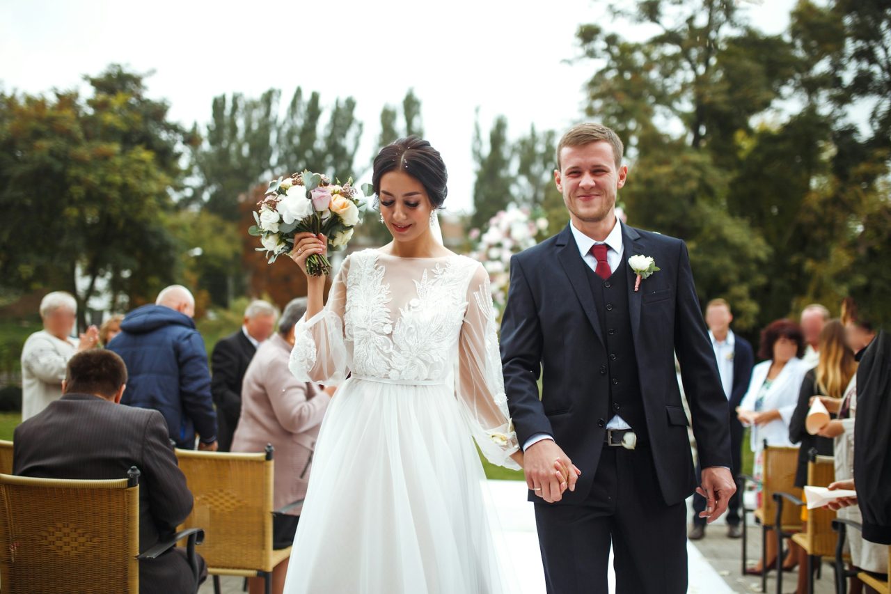 happy-groom-and-beautiful-bride-wedding-ceremony-under-the-arch-decorated-with-flowers-wedding-day-.jpg